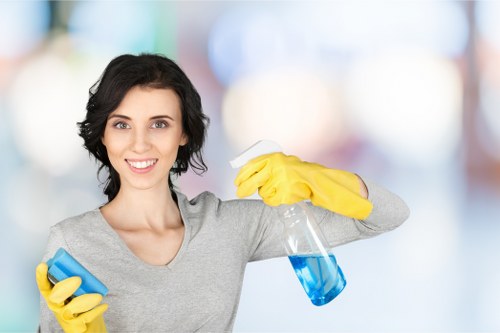 Local Battersea cleaner maintaining a modern apartment with routine dusting and floor care