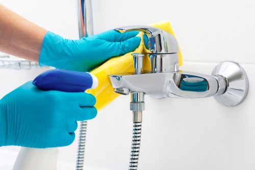Local oven cleaner working in a Battersea apartment kitchen